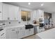 Bright kitchen with white cabinets, stainless steel appliances, and a view to the backyard at 11826 Corenzio Ave, Las Vegas, NV 89138