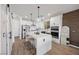 Modern kitchen with a large island, sleek appliances, and ample counter space perfect for cooking and entertaining at 11826 Corenzio Ave, Las Vegas, NV 89138