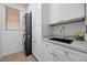 Well-equipped laundry room with modern appliances, ample counter space, and stylish cabinetry at 11826 Corenzio Ave, Las Vegas, NV 89138