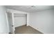 Bright bedroom shows neutral walls and closet with shelving; tile flooring throughout at 1308 Harriet St, Las Vegas, NV 89101