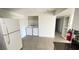 Kitchen area offers white appliances including washer and dryer plus a fridge at 1308 Harriet St, Las Vegas, NV 89101