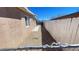 A narrow side yard featuring desert landscaping and a white fence for privacy at 1308 Harriet St, Las Vegas, NV 89101