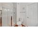 Bathroom includes a glass-enclosed shower with white tiled walls and silver fixtures plus a white toilet at 1840 N Jones Blvd, Las Vegas, NV 89108