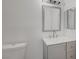 Bathroom featuring a modern vanity, toilet, and mirror at 1840 N Jones Blvd, Las Vegas, NV 89108