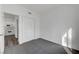 Clean bedroom with closet space, neutral carpet, and view of the kitchen at 1840 N Jones Blvd, Las Vegas, NV 89108