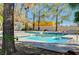 Community swimming pool with sparkling blue water and surrounding trees at 1840 N Jones Blvd, Las Vegas, NV 89108
