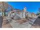 Low angle view of home with red tile roof and desert landscaping at 1840 N Jones Blvd, Las Vegas, NV 89108
