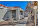 Home exterior featuring a covered entry and desert landscaping at 1840 N Jones Blvd, Las Vegas, NV 89108