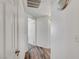 Hallway featuring wood-look flooring and doorway leading to carpeted room at 1840 N Jones Blvd, Las Vegas, NV 89108