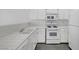 Functional kitchen featuring white appliances and cabinetry, providing ample space for meal preparation and storage at 1840 N Jones Blvd, Las Vegas, NV 89108