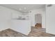Bright, modern kitchen with white cabinets, stainless steel appliances, and an open layout connected to the dining area at 1840 N Jones Blvd, Las Vegas, NV 89108