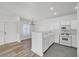 Well-lit kitchen with white cabinetry, offering a view into the dining area with modern light fixtures at 1840 N Jones Blvd, Las Vegas, NV 89108