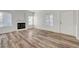 Cozy living room featuring a fireplace and wood-look floors at 1840 N Jones Blvd, Las Vegas, NV 89108