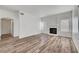Bright living room with wood-look floors and a fireplace at 1840 N Jones Blvd, Las Vegas, NV 89108