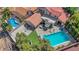 This aerial shot shows a sparkling pool and well-maintained backyard with mature trees for added privacy at 1853 Heydon Ct, Henderson, NV 89014