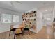 Charming breakfast nook by the windows with a wooden table and lots of sunlight at 1853 Heydon Ct, Henderson, NV 89014