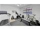 Bright exercise room with a treadmill, exercise bike, weights, and a bench at 1853 Heydon Ct, Henderson, NV 89014