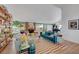 Spacious living room with stylish furnishings, fireplace, and decorative bookshelves at 1853 Heydon Ct, Henderson, NV 89014