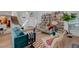Open living room featuring staircase, stylish furniture, and built in bookshelves at 1853 Heydon Ct, Henderson, NV 89014