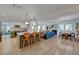 Open concept living space with updated kitchen, living room, dining area, and hardwood floors at 1853 Heydon Ct, Henderson, NV 89014