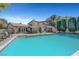 Beautiful pool with patio space for dining and lounging, surrounded by lush greenery at 1853 Heydon Ct, Henderson, NV 89014
