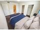 Bedroom featuring a comfortable bed, closet space, and a doorway to the bathroom at 1964 Las Palmas Ln # 244, Laughlin, NV 89029