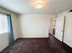 Bedroom featuring neutral walls, carpeting, and a door to the bathroom at 1964 Las Palmas Ln # 244, Laughlin, NV 89029