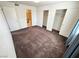 Bedroom with neutral walls, plush carpeting, and closet space, filled with natural light at 1964 Las Palmas Ln # 244, Laughlin, NV 89029