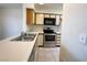 Well-equipped kitchen featuring stainless steel appliances and tile flooring at 1964 Las Palmas Ln # 244, Laughlin, NV 89029