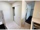 Practical laundry area with a stacked washer/dryer unit, adjacent to the kitchen at 1964 Las Palmas Ln # 244, Laughlin, NV 89029