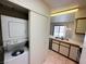 Convenient laundry area with washer and dryer near the kitchen and dining space at 1964 Las Palmas Ln # 244, Laughlin, NV 89029