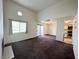 Spacious living area with fireplace, high ceilings, natural light, and access to the balcony at 1964 Las Palmas Ln # 244, Laughlin, NV 89029