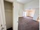 Living room showcasing neutral tones and carpet flooring, with a view of the kitchen at 1964 Las Palmas Ln # 244, Laughlin, NV 89029