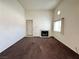 Living room featuring fireplace, tall ceilings, large window and front door at 1964 Las Palmas Ln # 244, Laughlin, NV 89029