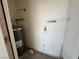 Utility closet featuring a newer model Rheem water heater, wall-mounted safety light and accessible outlets at 1964 Las Palmas Ln # 244, Laughlin, NV 89029