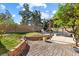 Lush backyard with a well-maintained lawn, brick patio, and pergola, perfect for outdoor entertaining and relaxation at 2163 Fountain Springs Dr, Henderson, NV 89074