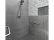 Modern bathroom featuring large tiles, a grab bar, and a shower niche at 2163 Fountain Springs Dr, Henderson, NV 89074