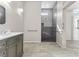 Modern bathroom with grab bars in the shower and sink area for accessibility and safety at 2163 Fountain Springs Dr, Henderson, NV 89074
