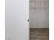 Bedroom walk-in closet with white walls, hardware floors and wire shelving at 2163 Fountain Springs Dr, Henderson, NV 89074