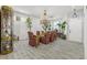 The dining room features an ornate chandelier, a table with six chairs, and natural light at 2163 Fountain Springs Dr, Henderson, NV 89074