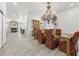 Open concept living space featuring wood flooring and a dining area with elegant chandelier at 2163 Fountain Springs Dr, Henderson, NV 89074