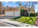 Charming single-story home with manicured lawn and three-car garage at 2163 Fountain Springs Dr, Henderson, NV 89074