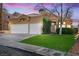 Charming single-story home with manicured lawn and three-car garage at 2163 Fountain Springs Dr, Henderson, NV 89074