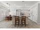 Bright kitchen featuring counter seating and an adjacent dining table at 2163 Fountain Springs Dr, Henderson, NV 89074