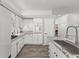 Well-appointed kitchen featuring white cabinets and granite countertops at 2163 Fountain Springs Dr, Henderson, NV 89074