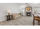 Cozy living area with a unique tiled fireplace and adjacent kitchen at 2163 Fountain Springs Dr, Henderson, NV 89074