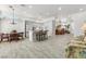 Bright and airy open-plan living area with dining table and kitchen island at 2163 Fountain Springs Dr, Henderson, NV 89074
