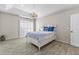 Serene bedroom with tray ceilings, light-colored walls, and wood floors at 2163 Fountain Springs Dr, Henderson, NV 89074