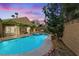 Backyard pool and spa with manicured landscaping and privacy wall at 2163 Fountain Springs Dr, Henderson, NV 89074