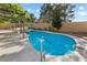 Inviting pool area with a pergola, lush greenery, and a serene ambiance, perfect for relaxation and entertaining at 2163 Fountain Springs Dr, Henderson, NV 89074